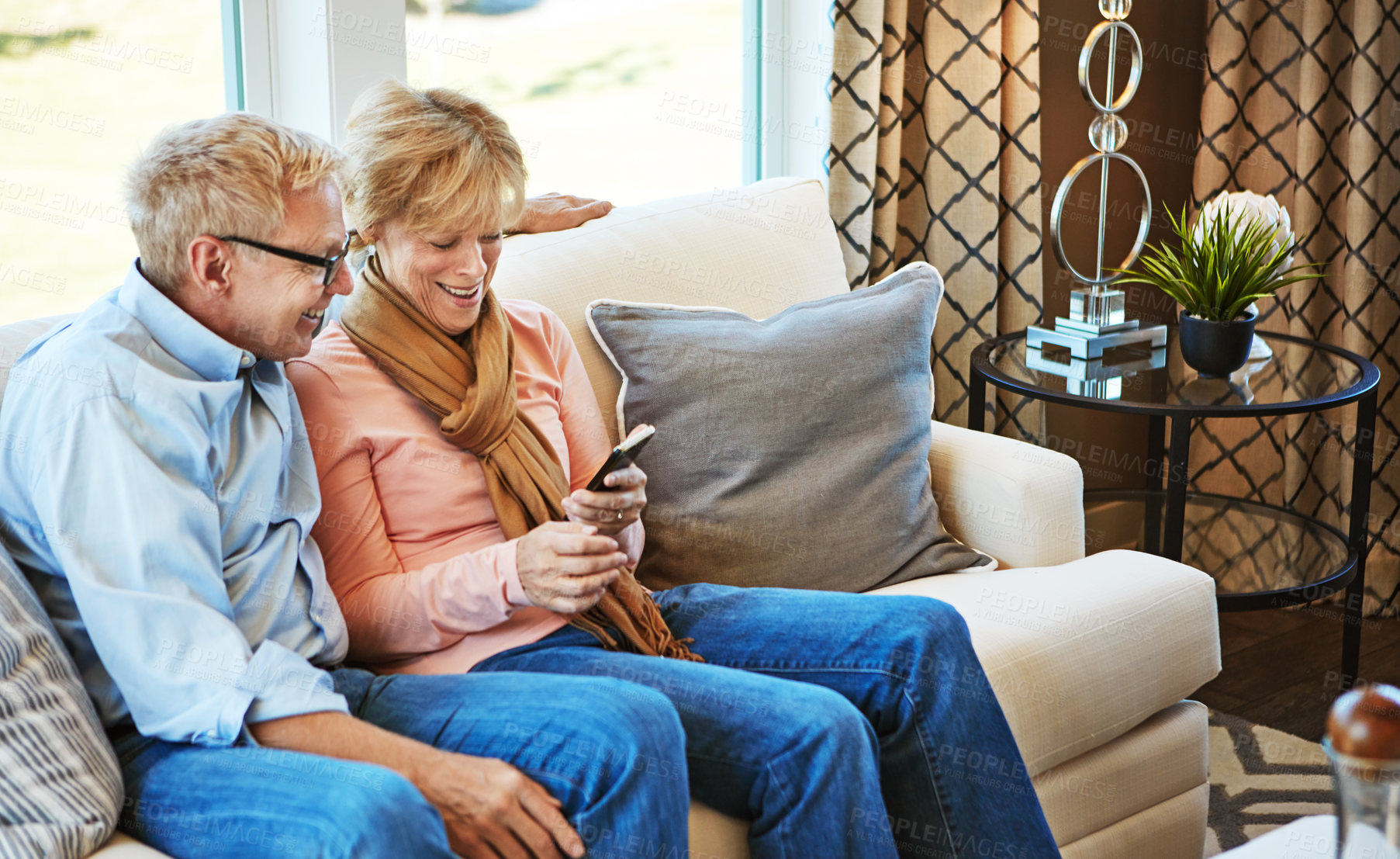 Buy stock photo Phone, mature or happy couple on social media on couch for communication, meme or internet connection. Home, senior man or woman on mobile app to search, relax or scroll online on sofa in living room