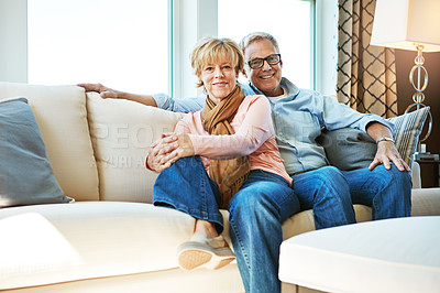 Buy stock photo Relax, retirement and portrait of couple on sofa for bonding, healthy relationship and marriage. Happy, home and senior man and woman hug on couch for love, commitment and embrace in living room