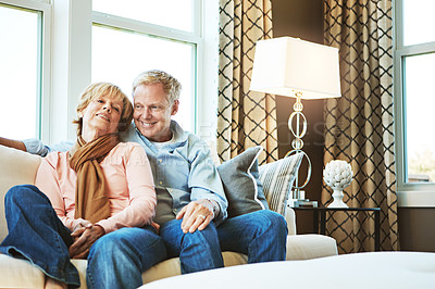 Buy stock photo Relax, love and mature couple on sofa hug for bonding, healthy relationship and marriage. Retirement, home and senior man and woman on couch for embrace, commitment and happiness in living room