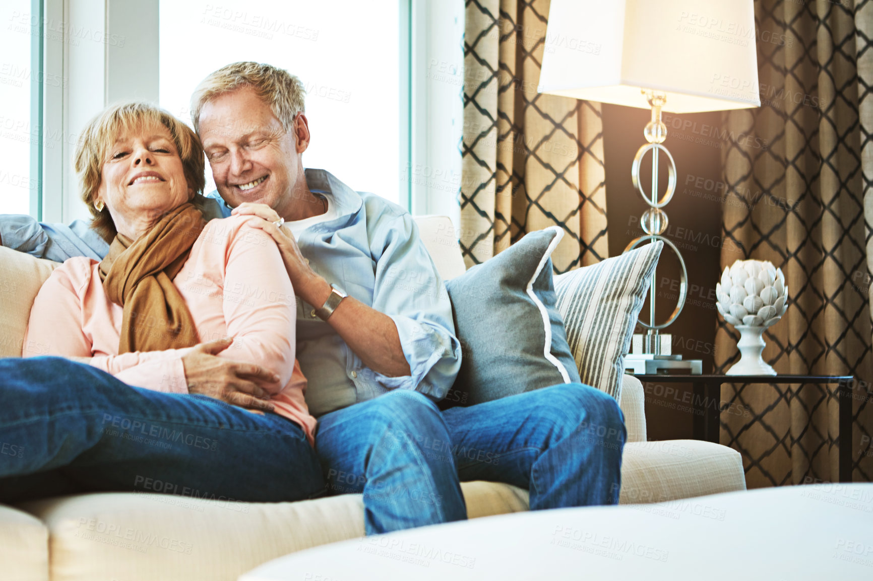 Buy stock photo Relax, sofa and happy old couple in home for bonding, healthy relationship and marriage. Retirement, smile and senior man and woman hug on couch for love, commitment and happiness in living room