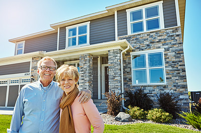 Buy stock photo Portrait of a happy senior couple posing outside their new home