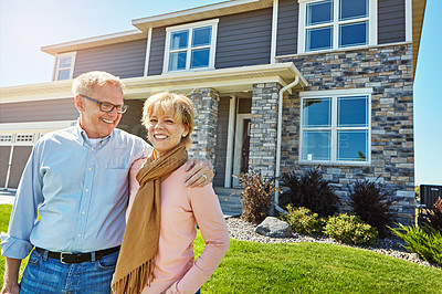 Buy stock photo Portrait of a happy senior couple posing outside their new home