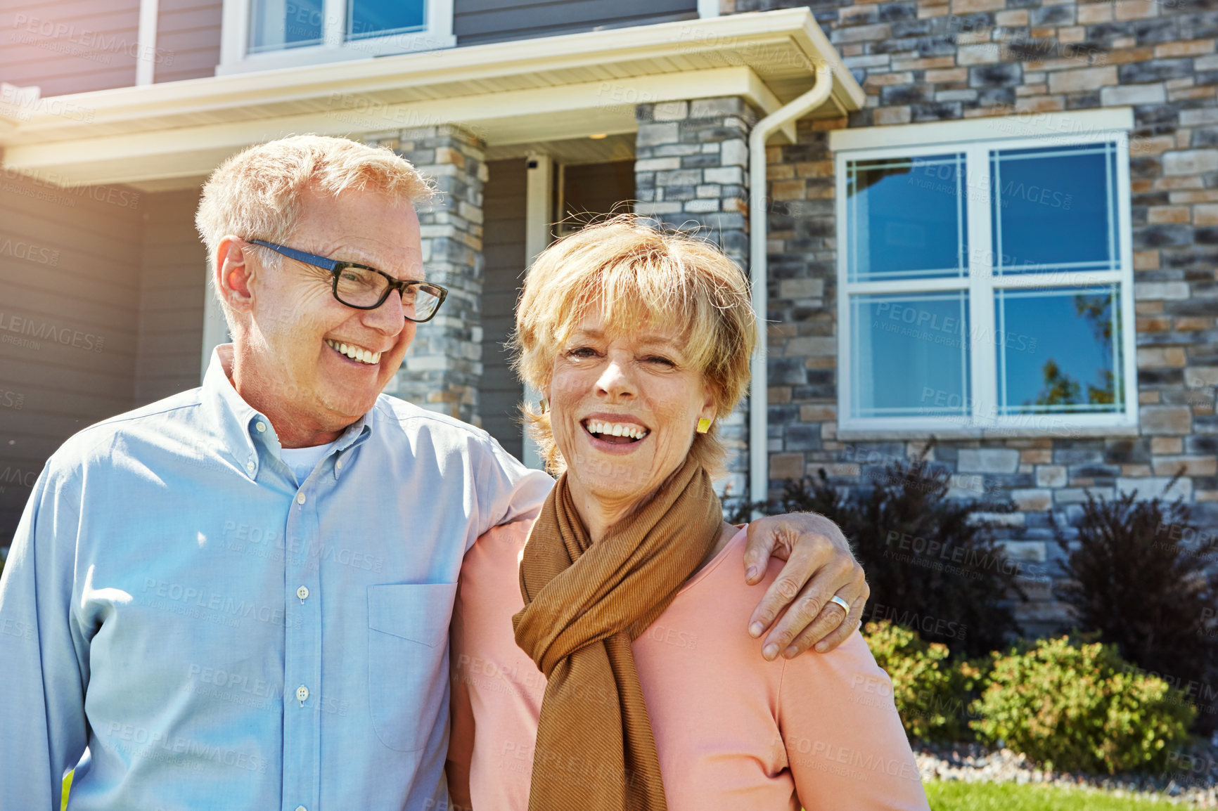 Buy stock photo Portrait of a happy senior couple posing outside their new home