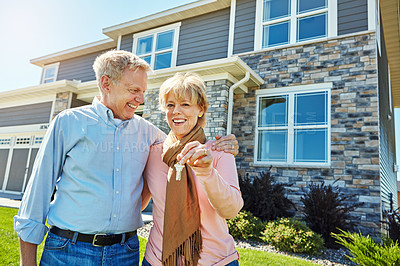 Buy stock photo Portrait of a happy senior couple posing outside their new home