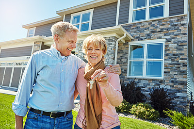 Buy stock photo Portrait of a happy senior couple posing outside their new home