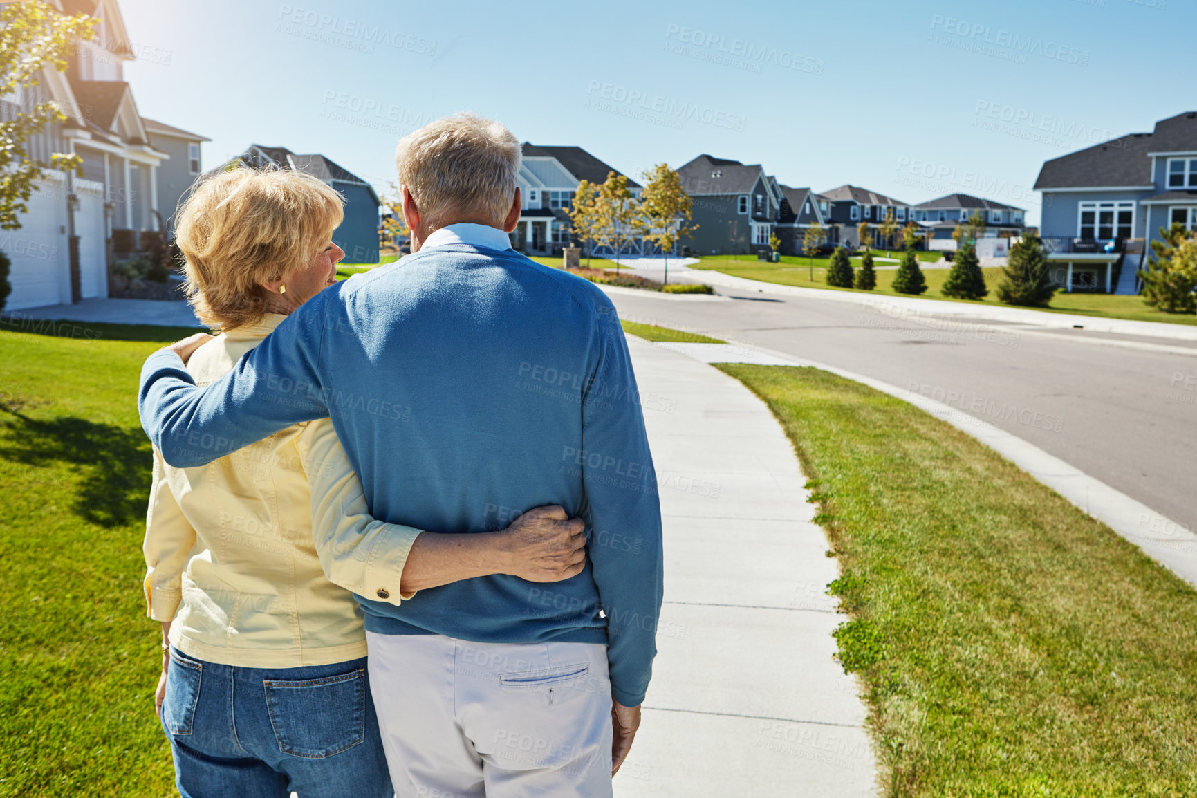 Buy stock photo Walking, happy and back of couple in neighborhood with bonding, connection or marriage together. Smile, love and mature man embrace with woman outdoor in suburbs with support, trust and relationship.