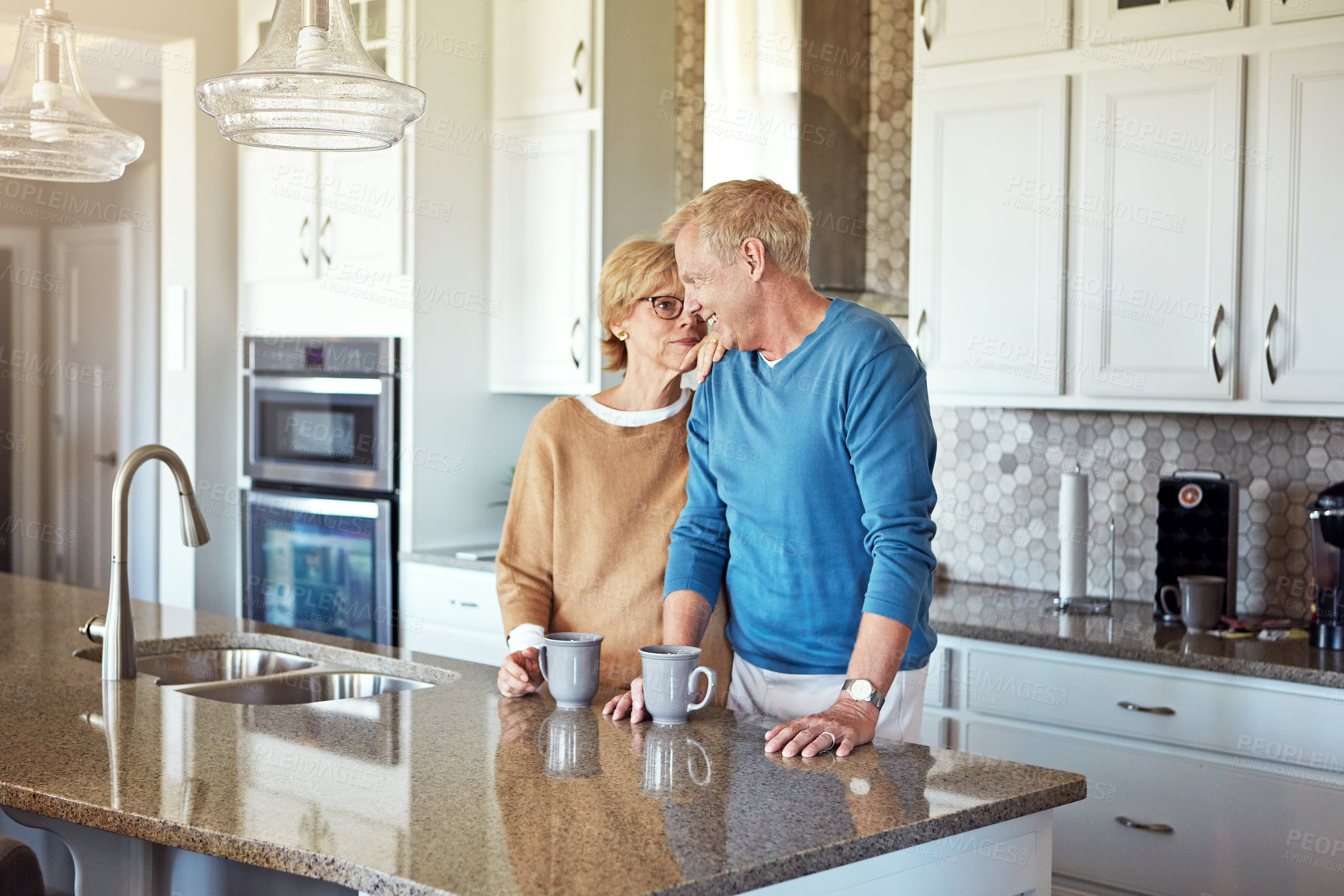 Buy stock photo Mature couple, love and relax in kitchen with trust, support and healthy relationship. Property owners, happy and comfort at home for bonding, funny storytelling and good joke in Australia with care