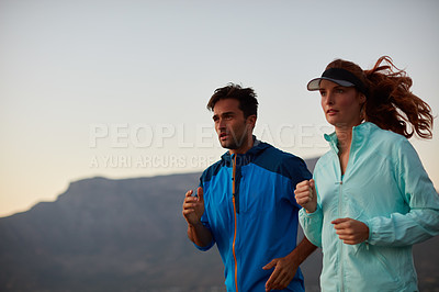 Buy stock photo Couple, running and sports exercise in outdoor, morning and cardio challenge or marathon training. People, action and bonding together on jog in nature, fitness and winter workout or practice