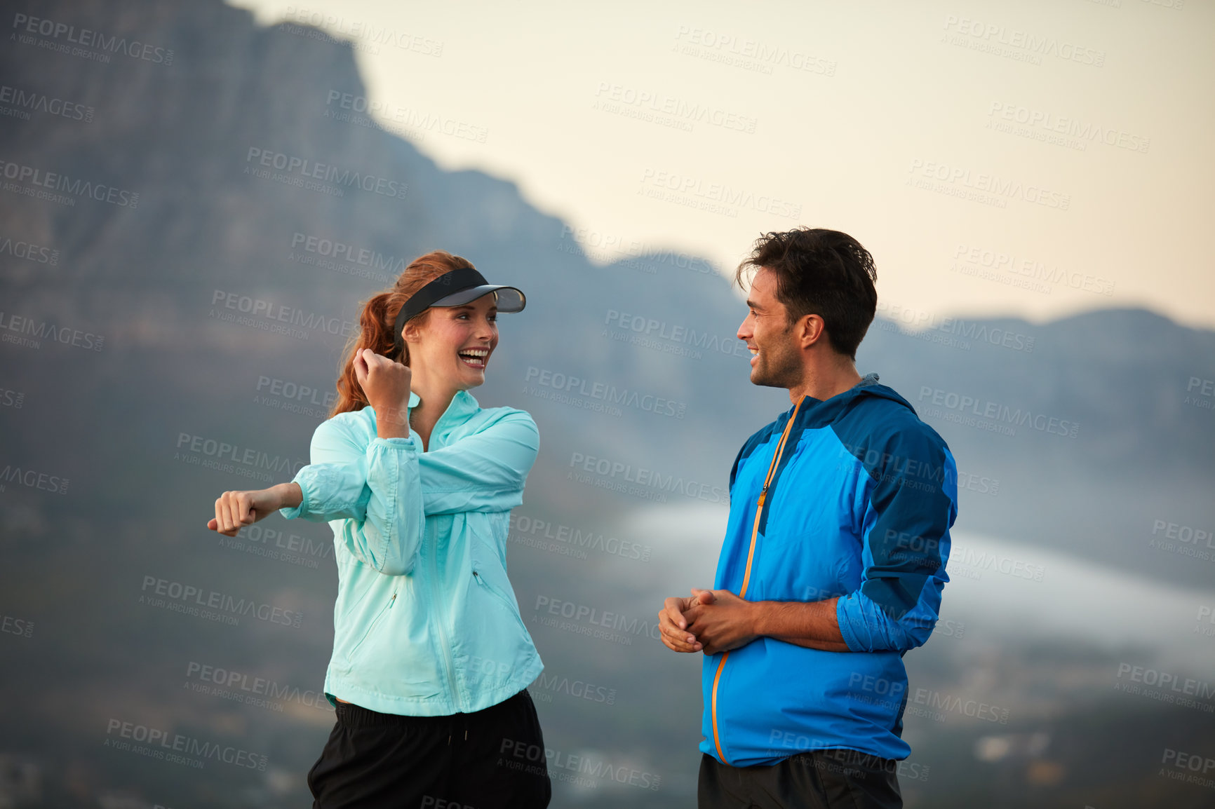 Buy stock photo Shot of an athletic young couple out for a run in the morning