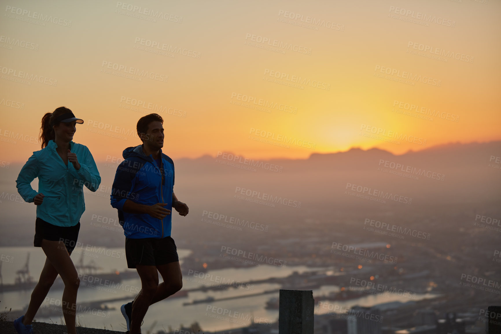 Buy stock photo Sunrise, couple and silhouette with mountain running for training, exercise and fitness with cardio. Wellness, sport and athlete with runner partner in nature together at morning with mockup space