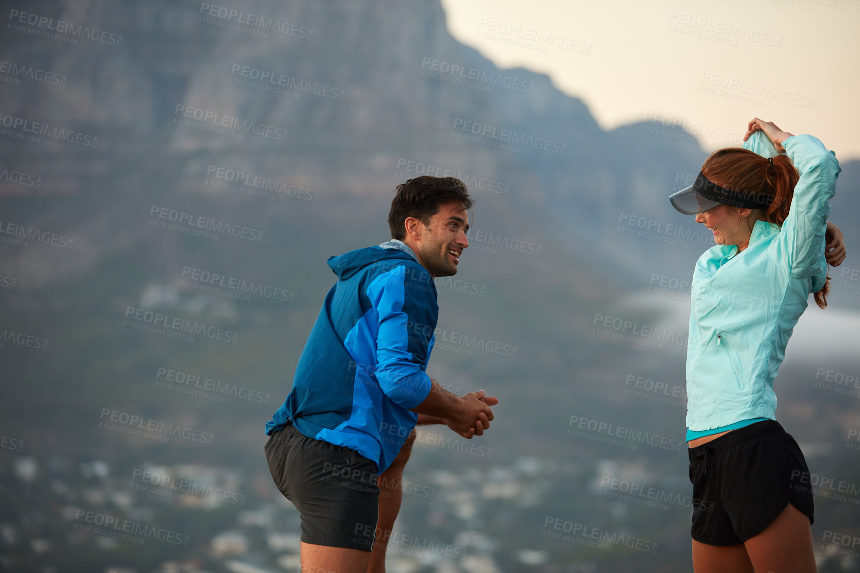 Buy stock photo Shot of an athletic young couple out for a run in the morning