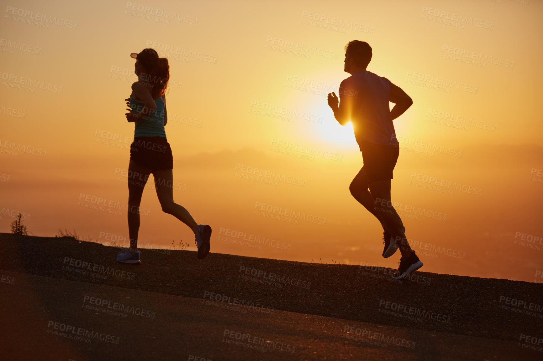 Buy stock photo Sunrise, couple and running silhouette outdoor for race training, exercise and fitness with cardio for health. Wellness, sport and athlete with runner partner in nature in the morning with sprint