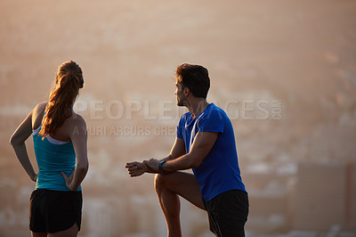 Buy stock photo Shot of an athletic young couple out for a run in the morning