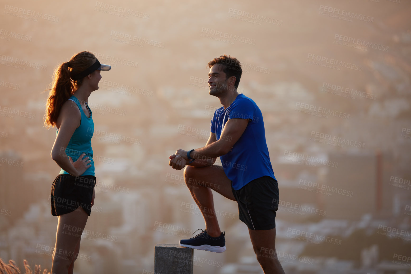 Buy stock photo Shot of an athletic young couple out for a run in the morning