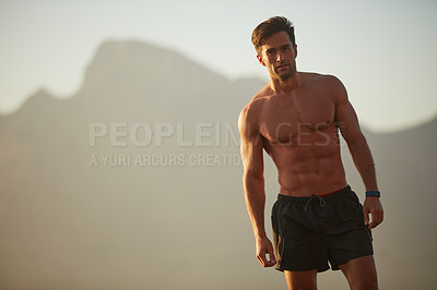 Buy stock photo Portrait of a handsome shirtless man working out outside