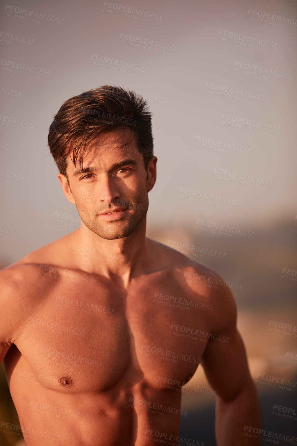 Buy stock photo Portrait of a handsome shirtless man working out outside