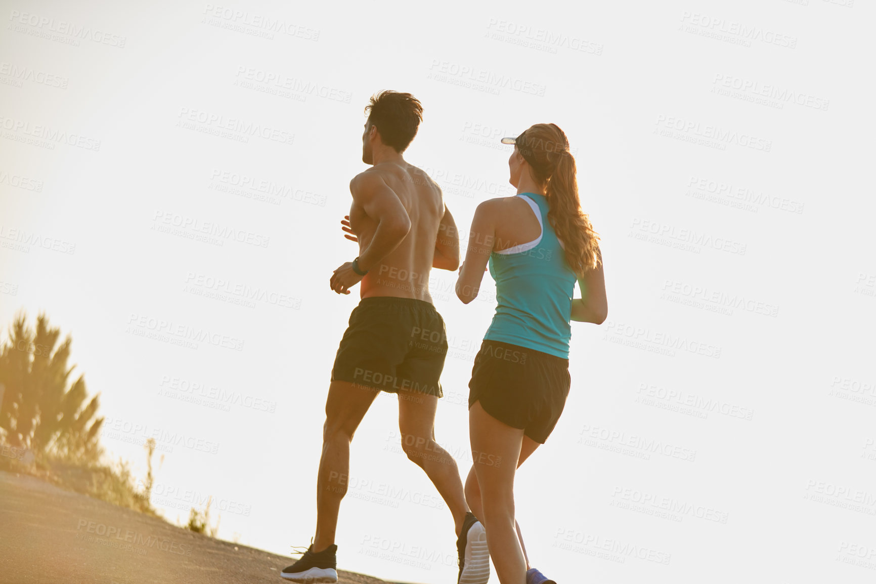 Buy stock photo Couple, running and workout on mountain street, race and cardio challenge or marathon training. People, action and bonding together on morning jog, back and sports performance in outdoor nature