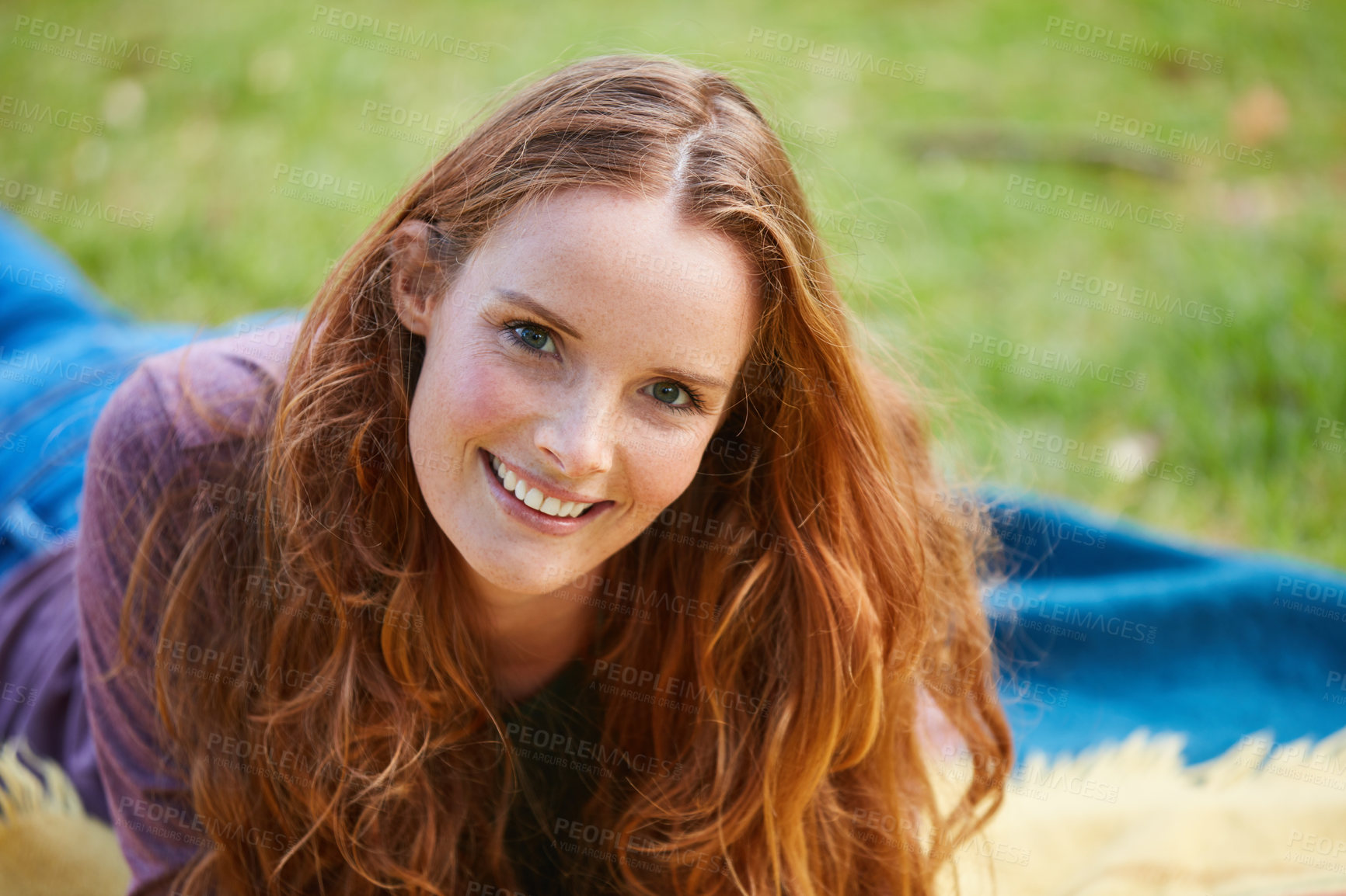 Buy stock photo Shot of a young woman relaxing at the park