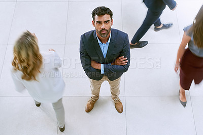 Buy stock photo Portrait of a businessman standing in a busy office