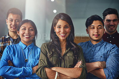 Buy stock photo Portrait of a team of confident young designers standing together in an office