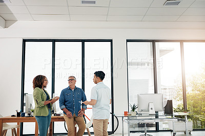 Buy stock photo Cropped shot of three creative professionals talking in the office