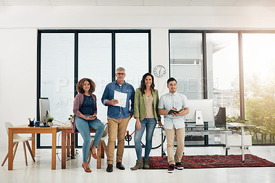 Buy stock photo Full length portrait of four creative colleagues standing in their office