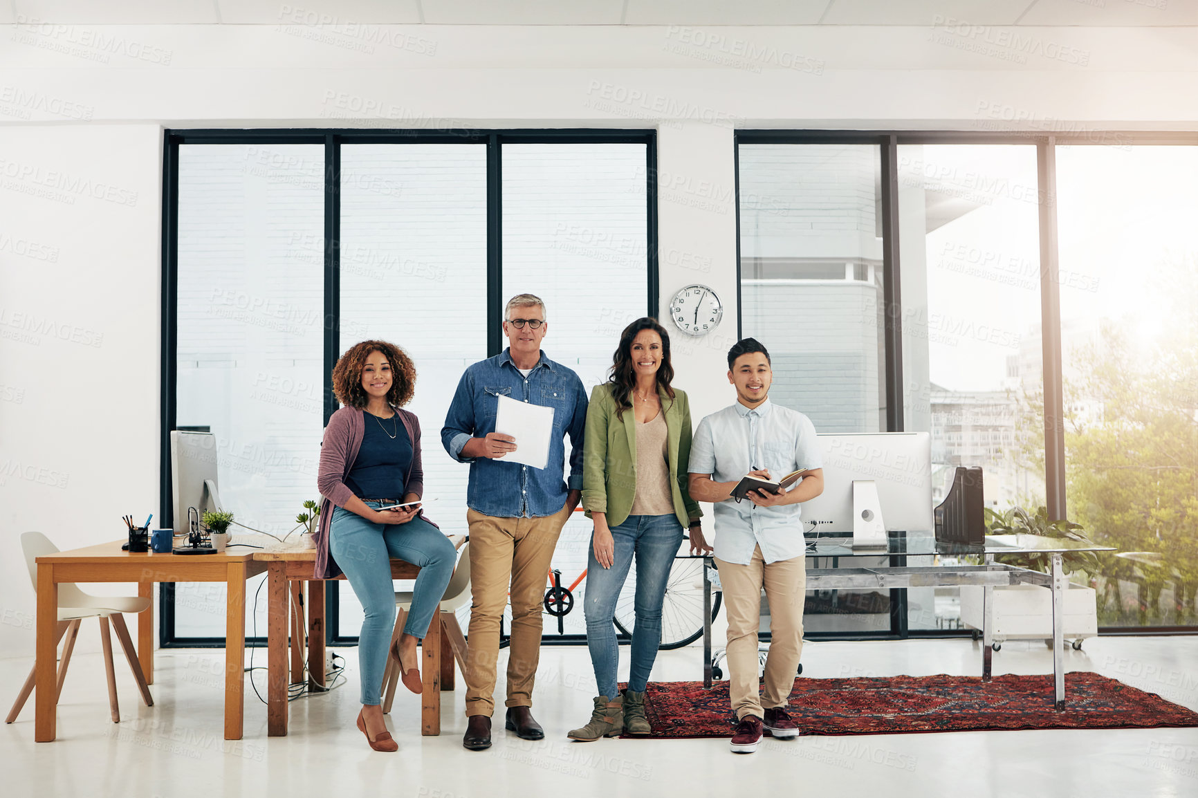 Buy stock photo Full length portrait of four creative colleagues standing in their office