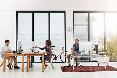 Buy stock photo Full length shot of three designers working in their creative office environment
