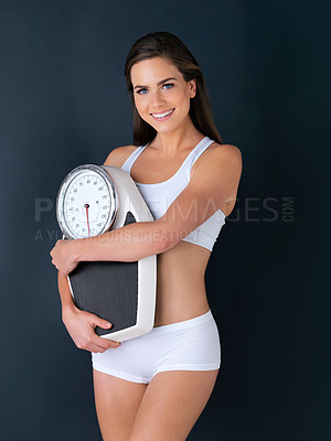 Buy stock photo Happy woman, portrait and scale to lose weight, diet or fitness for health and wellness against a studio background. Female person or model smile with weighing machine in healthy body on mockup space