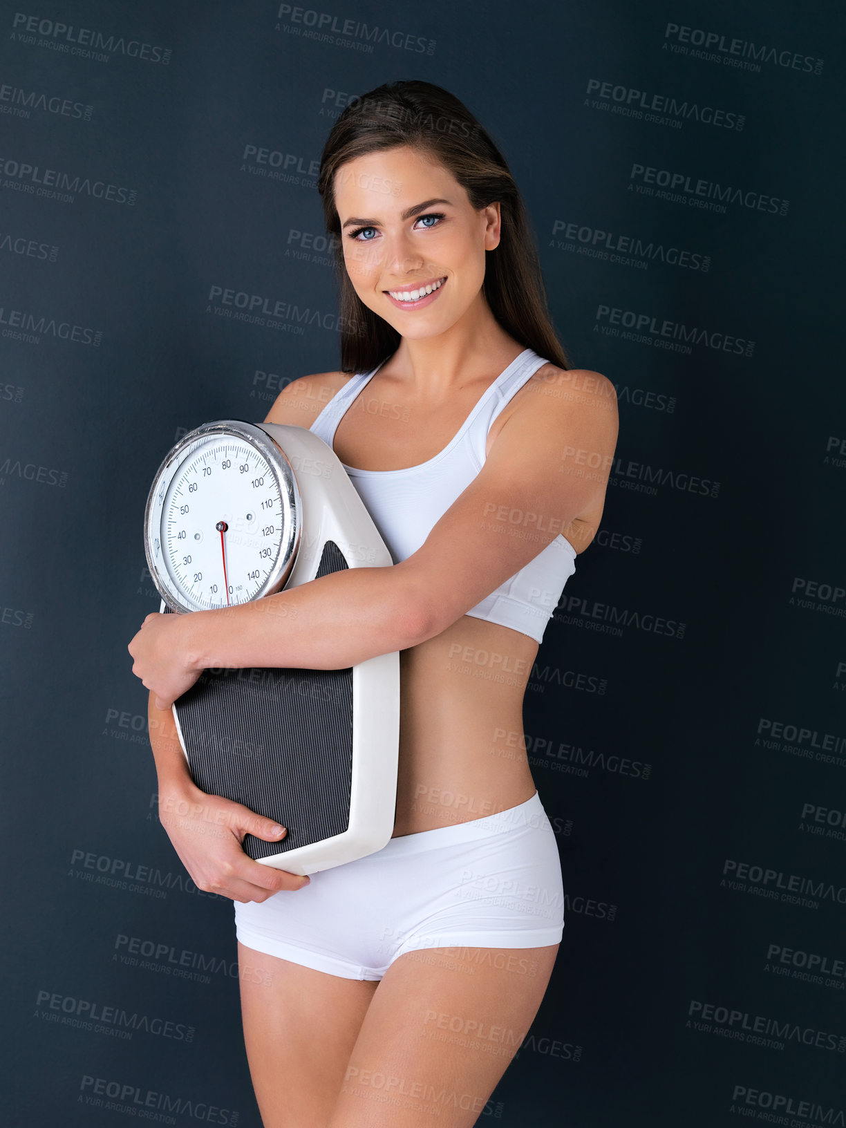 Buy stock photo Happy woman, portrait and scale to lose weight, diet or fitness for health and wellness against a studio background. Female person or model smile with weighing machine in healthy body on mockup space