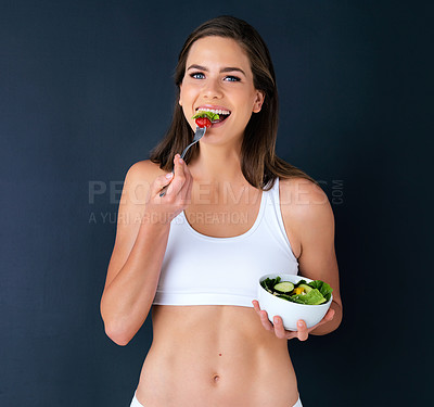 Buy stock photo Happy woman, portrait and eating salad for diet, lose weight or natural nutrition against a studio background. Female person or model smile with bowl of vegetables for food or healthy meal on mockup