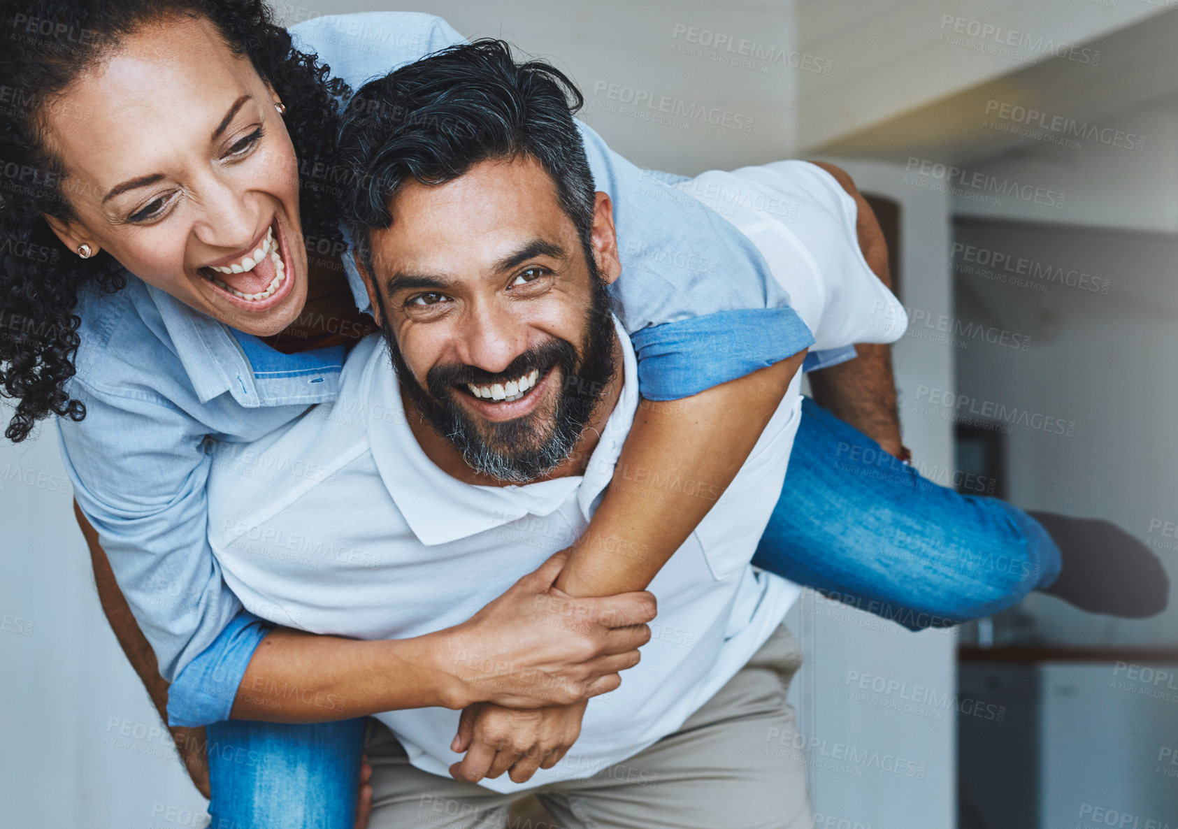 Buy stock photo Couple, people and laugh in home with piggyback to relax for bonding, love and support on break together. Smile, relationship and romance with fun or happy as family, soulmate and care or enjoy