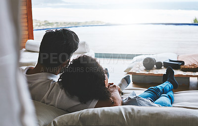 Buy stock photo Rearview shot of a relaxed couple enjoying the day at home together