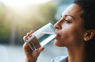 Buy stock photo Health, glass and woman drinking water, wellness and nutrition at home, happiness and refreshment. Female person, happy and lady with clear liquid, natural and care with a smile, fresh and hydration