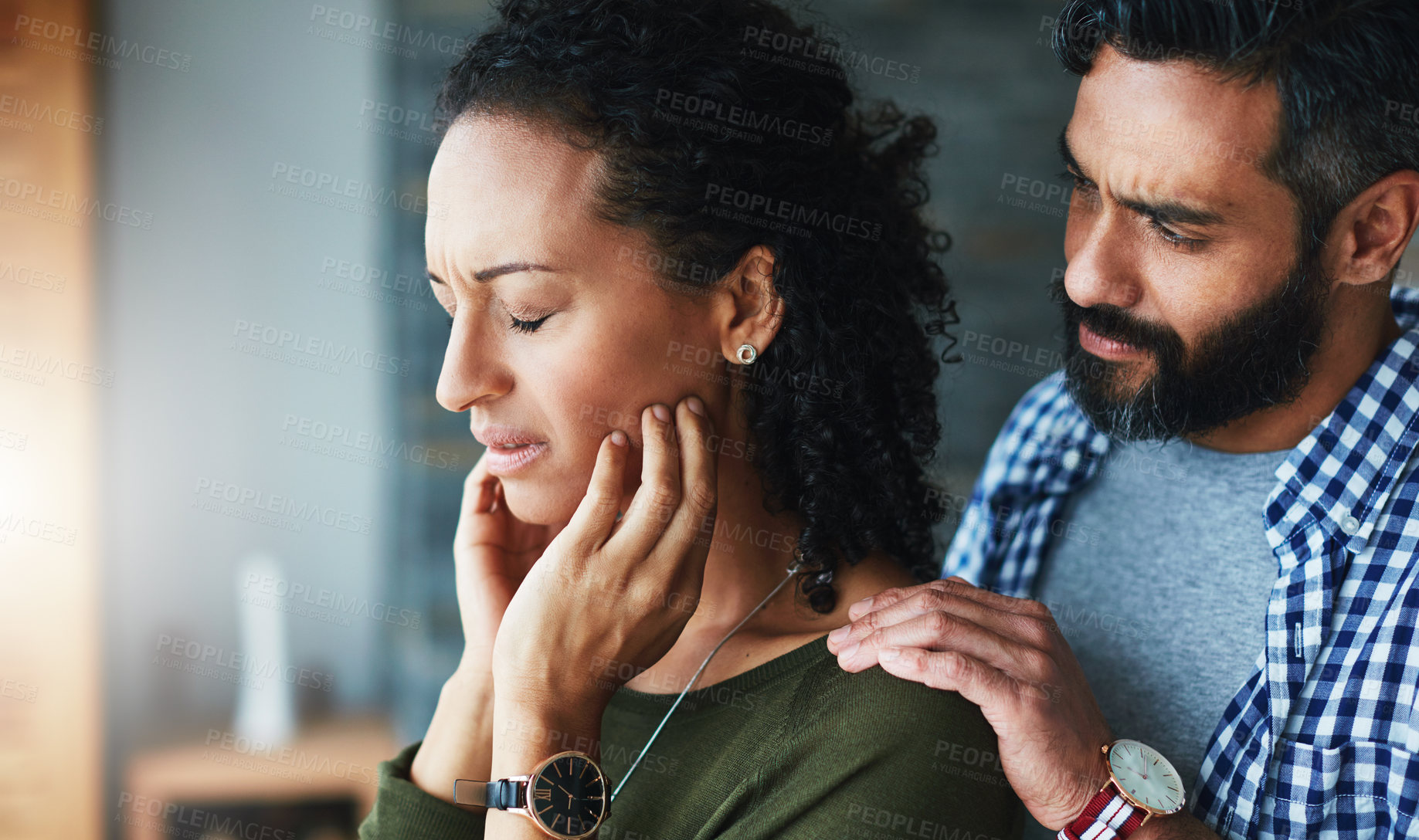 Buy stock photo Shot of a man comforting his distraught wife at home