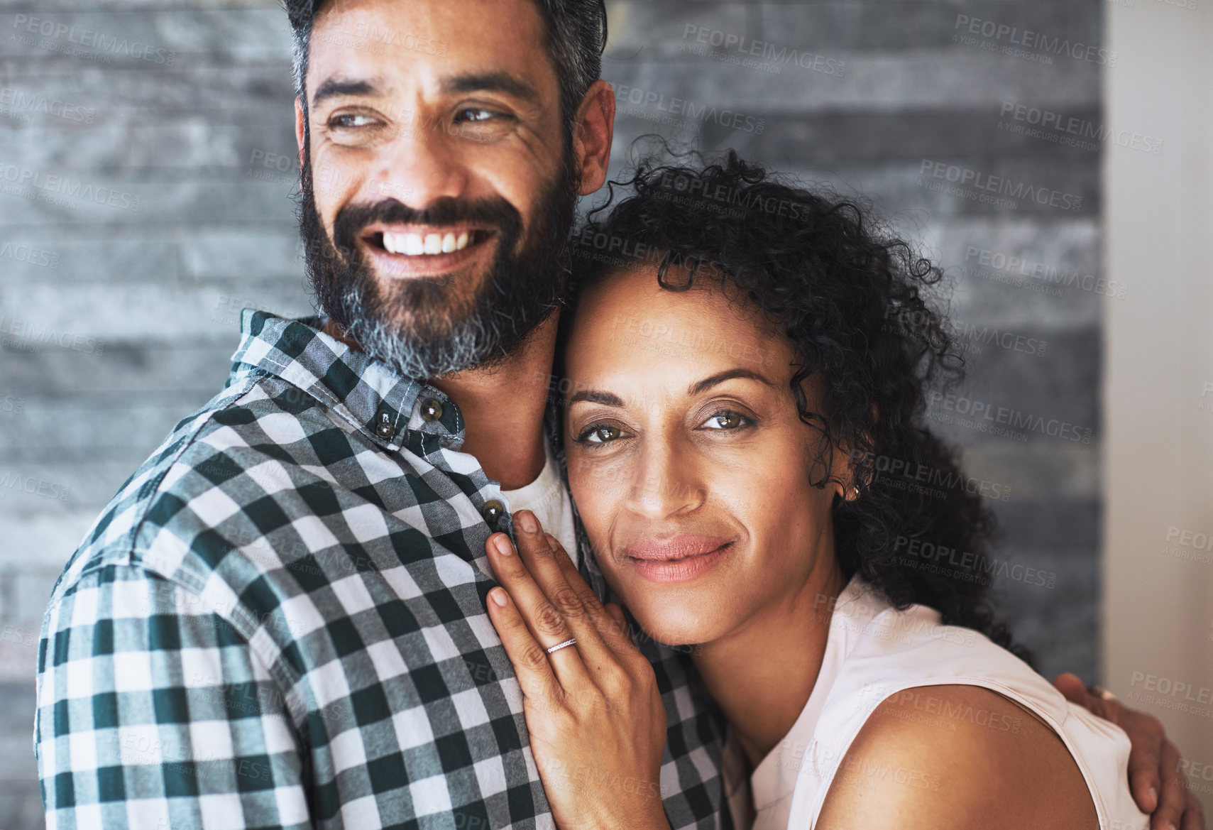 Buy stock photo Love, hug and portrait of couple in home for commitment, loving embrace and trust in living room. Relationship, marriage and face of man and woman smile for intimate moment, happy and romantic bond