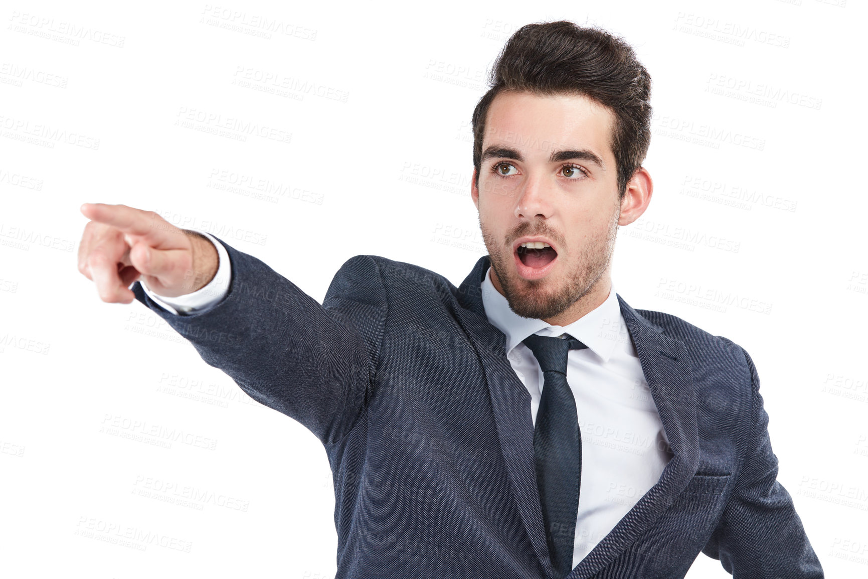 Buy stock photo Studio shot of a young businessman pointing towards something against a white background