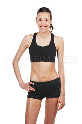 Buy stock photo Portrait of a fit, young woman standing with her hand on her hip against a white background