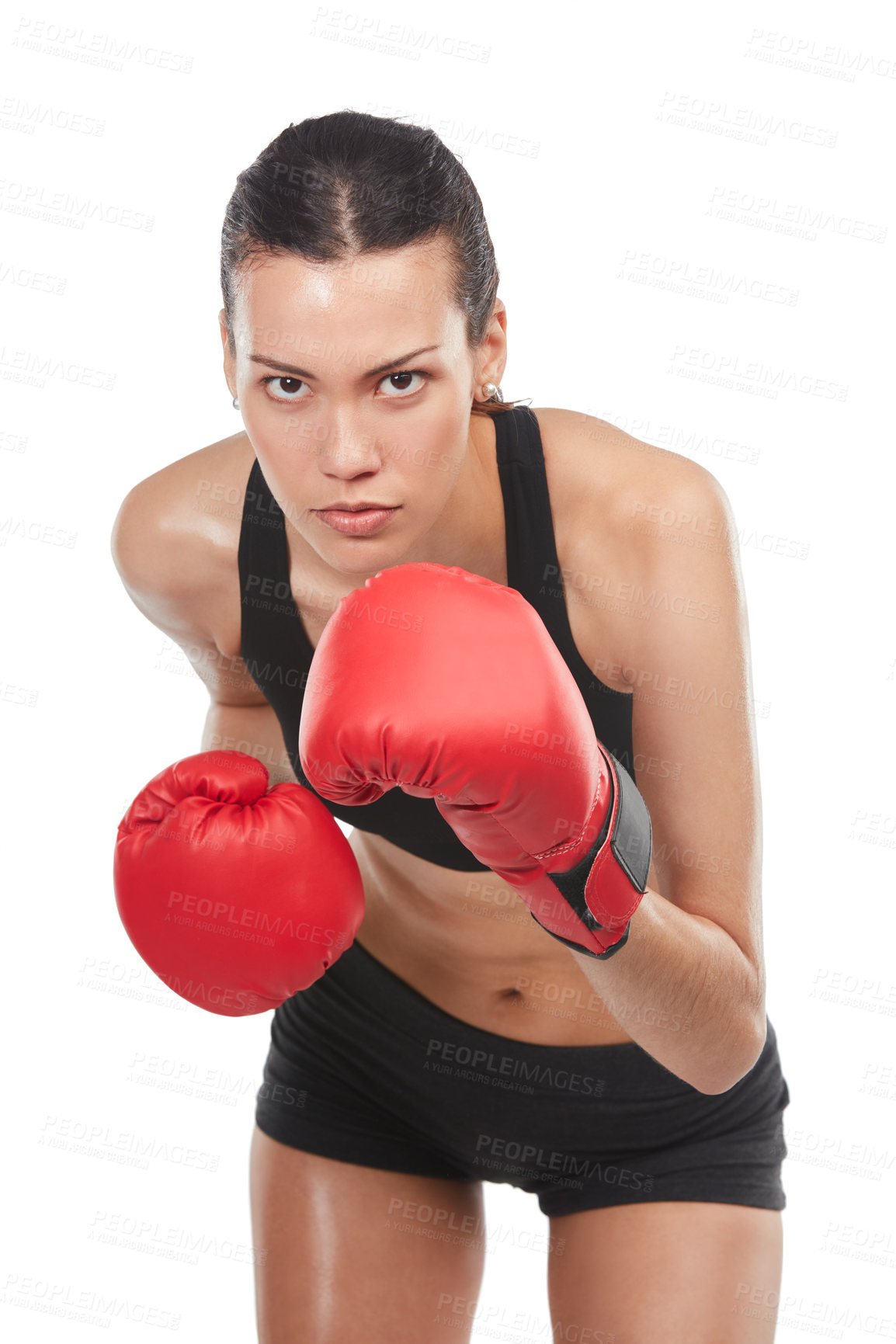 Buy stock photo Cropped portrait of a young female athlete boxing against a white background