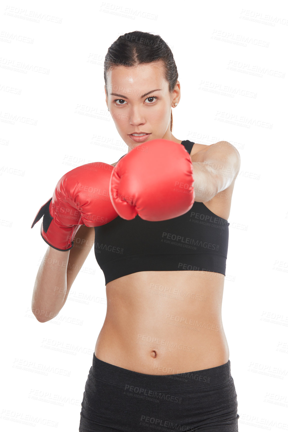 Buy stock photo Cropped portrait of a young female athlete boxing against a white background