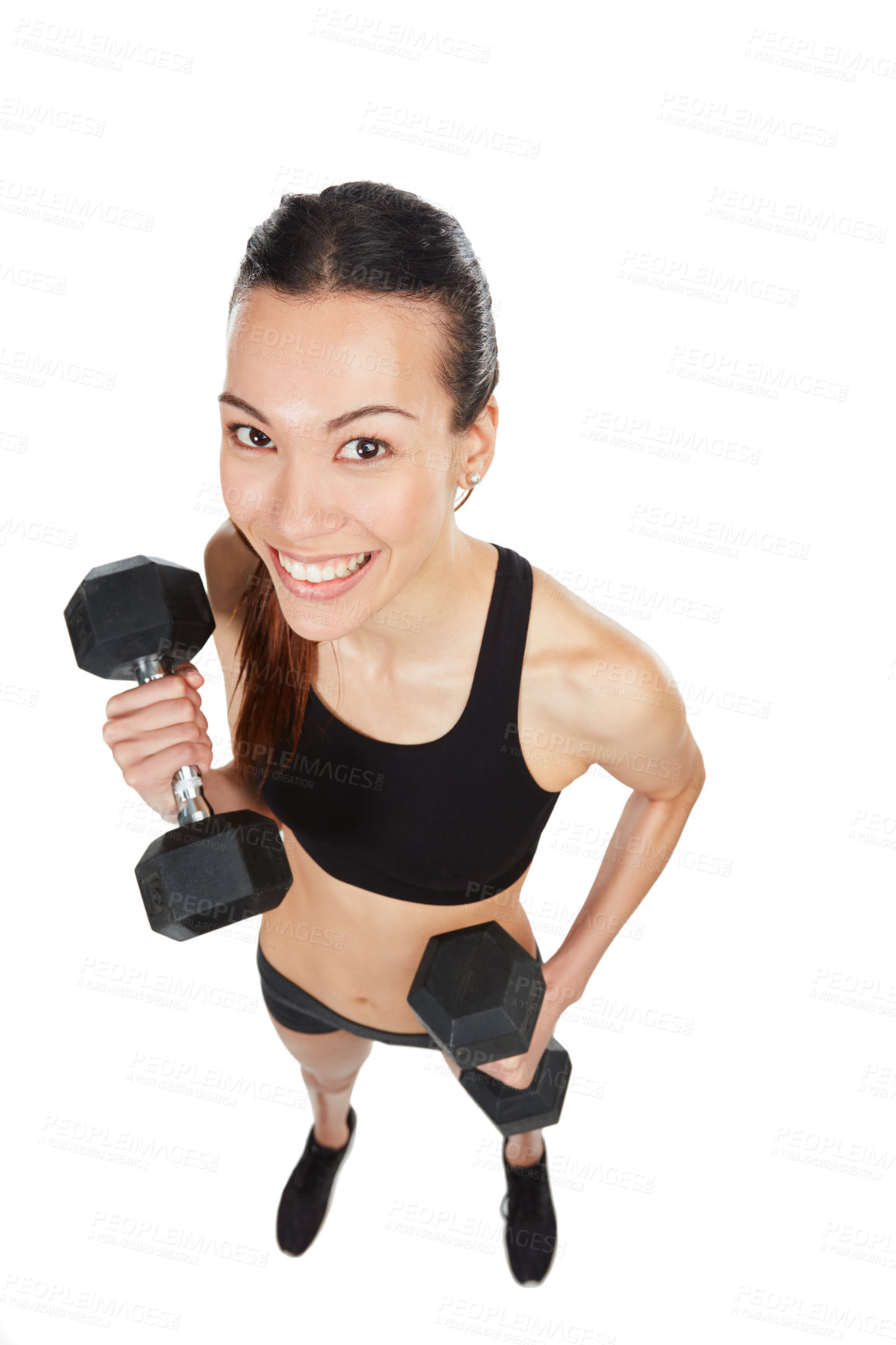 Buy stock photo Studio shot of a young woman working out with dumbbells against a white background