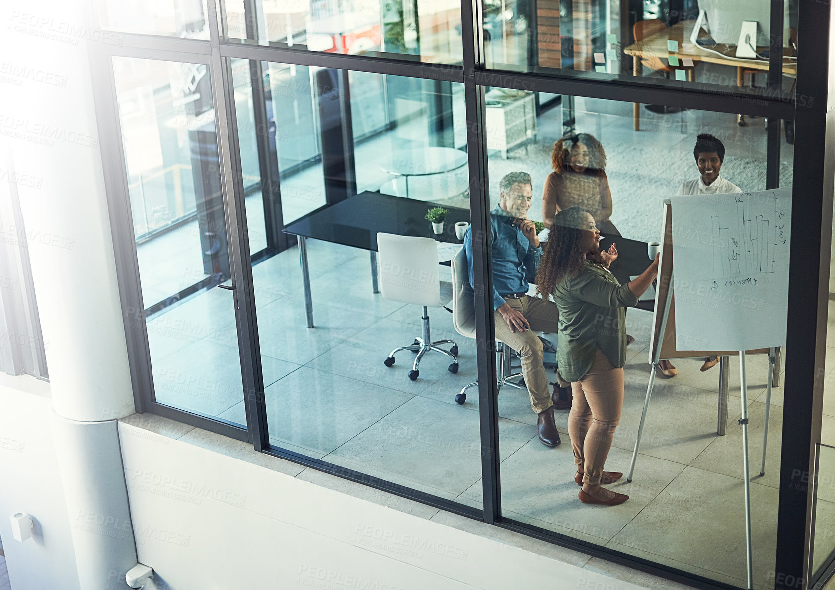 Buy stock photo High angle shot of a group of businesspeople having a meeting in a boardroom