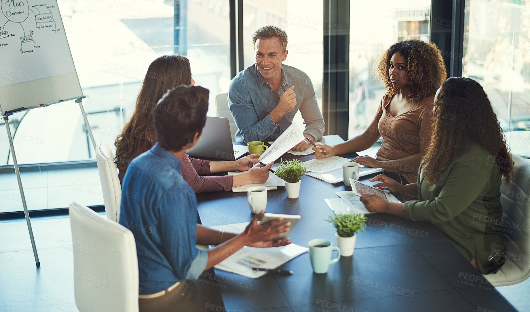Buy stock photo Business people, documents and discussion with finance, budget and teamwork with collaboration at startup. Men, women and planning with happy, meeting and review for revenue with diversity at company