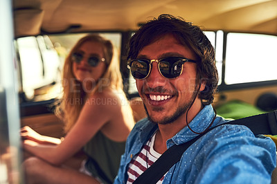 Buy stock photo Cropped portrait of an affectionate young couple taking a roadtrip together