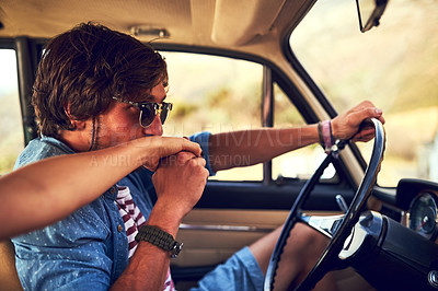 Buy stock photo Cropped shot of an affectionate young couple taking a roadtrip together