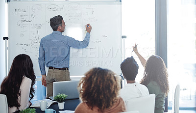 Buy stock photo Shot of a businessman delivering a presentation to his colleagues in a boardroom meeting