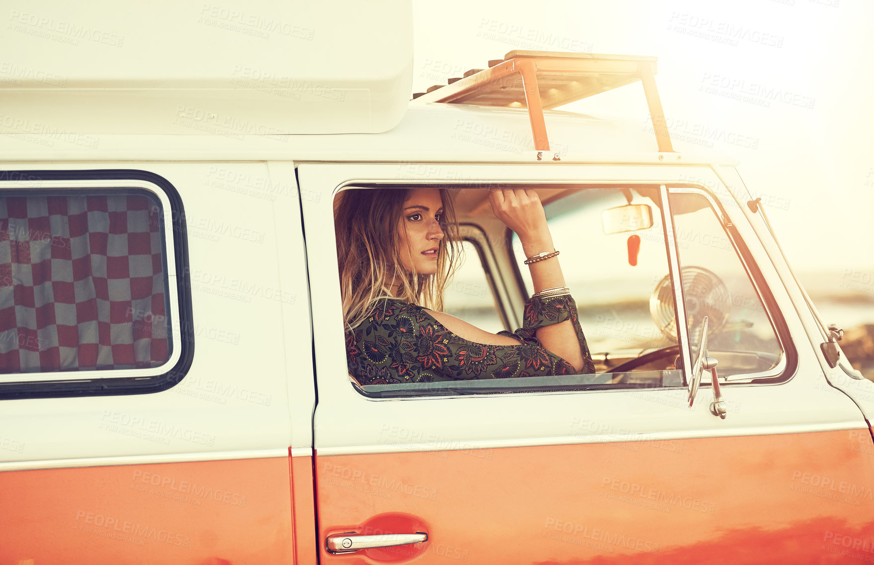 Buy stock photo Shot of a gorgeous young woman enjoying a roadtrip on her own