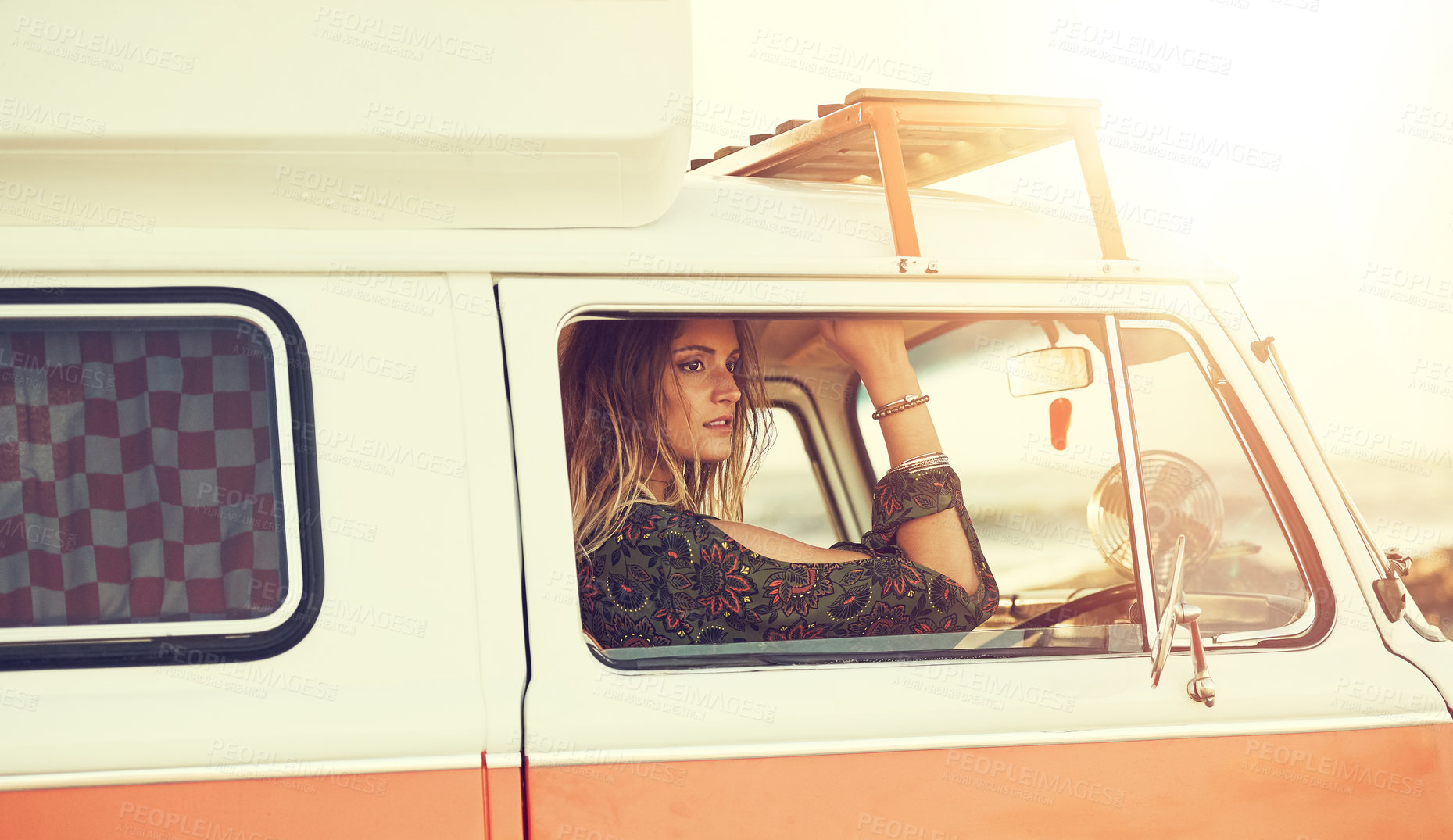 Buy stock photo Shot of a gorgeous young woman enjoying a roadtrip on her own