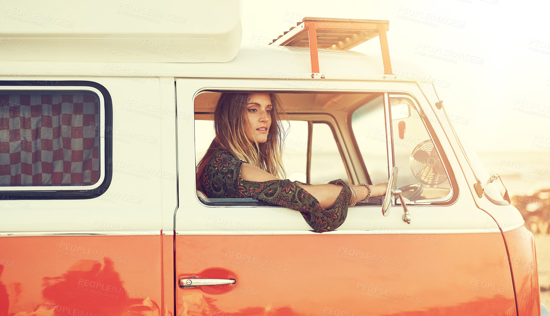 Buy stock photo Shot of a gorgeous young woman enjoying a roadtrip on her own