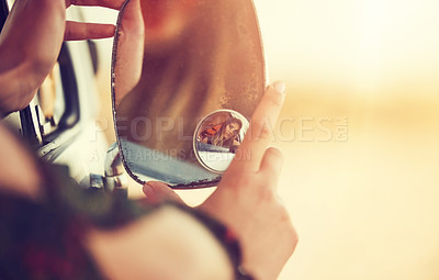 Buy stock photo Cropped shot of an unrecognizable young woman taking a roadtrip on her own